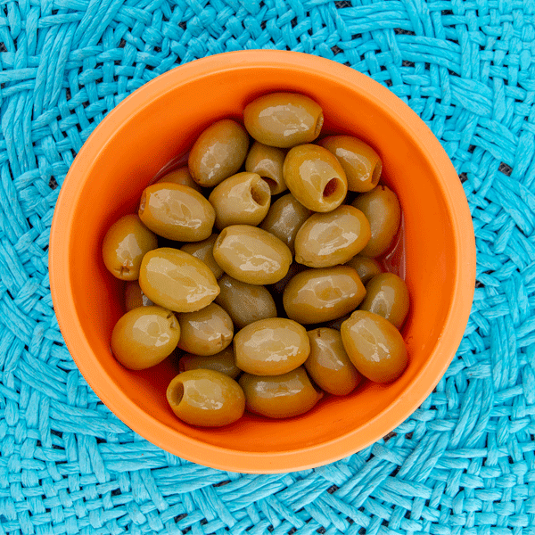 Bowl of pitted olives in bowl