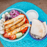 Greek bowl with pita bread and sauce
