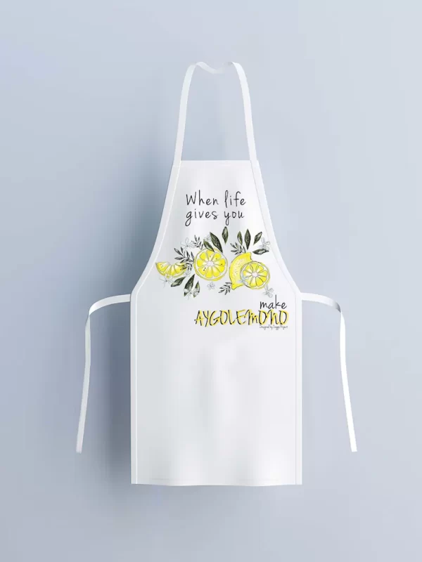 White apron with lemons and text "When life gives you lemons make aygolemono"